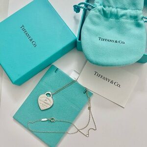 Brand new Tiffany & Co. Silver Heart Tag Pendant Necklace with a diamond
